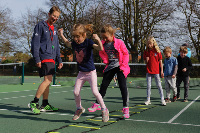 Woodbridge Tennis Club head coach Jon Mansfield takes a class